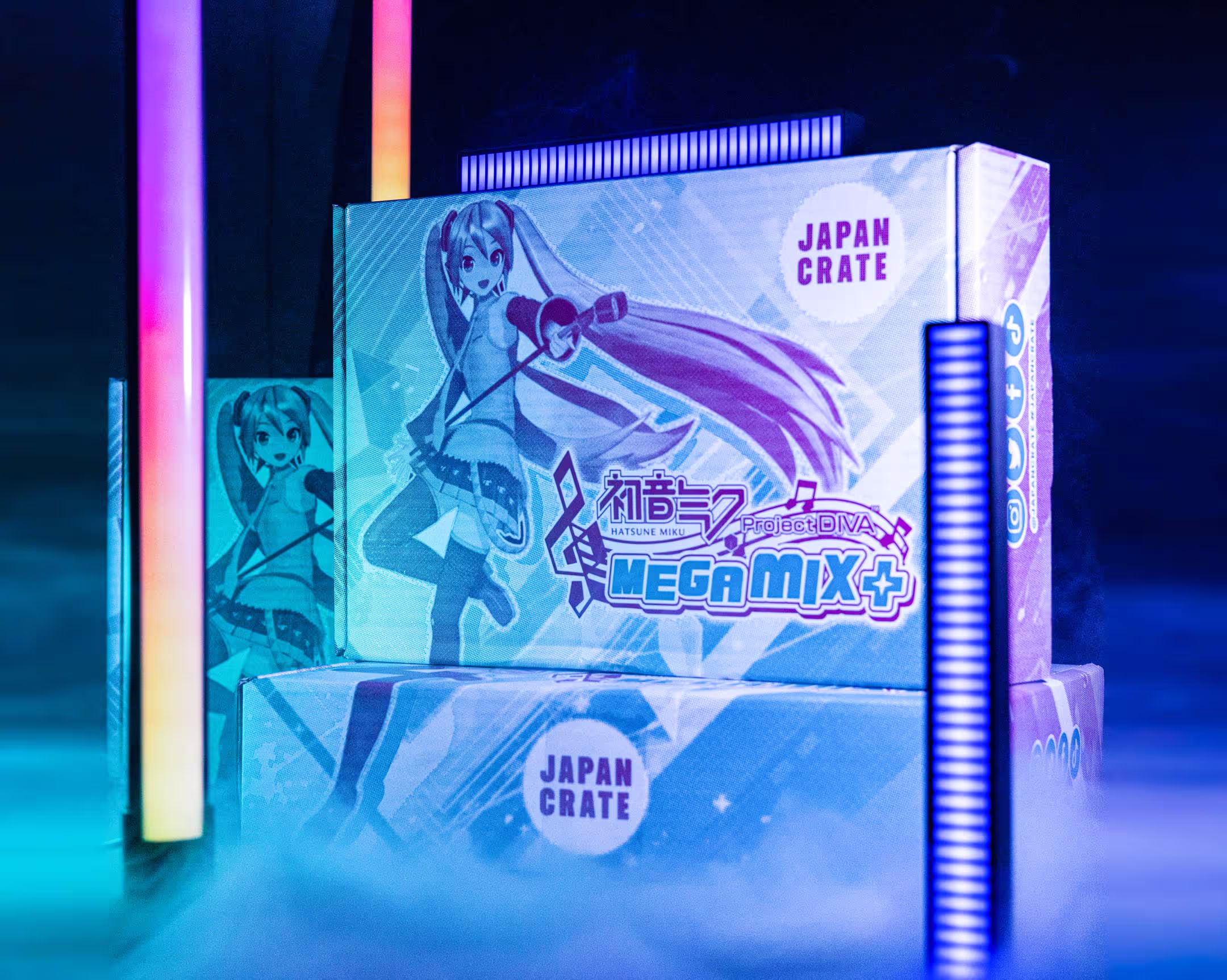 A package featuring bright and vivid art and branding from Miku Hatsune - Megamix, the video game published by Sega. The background features fluorescent lights and smoke circling around the product.