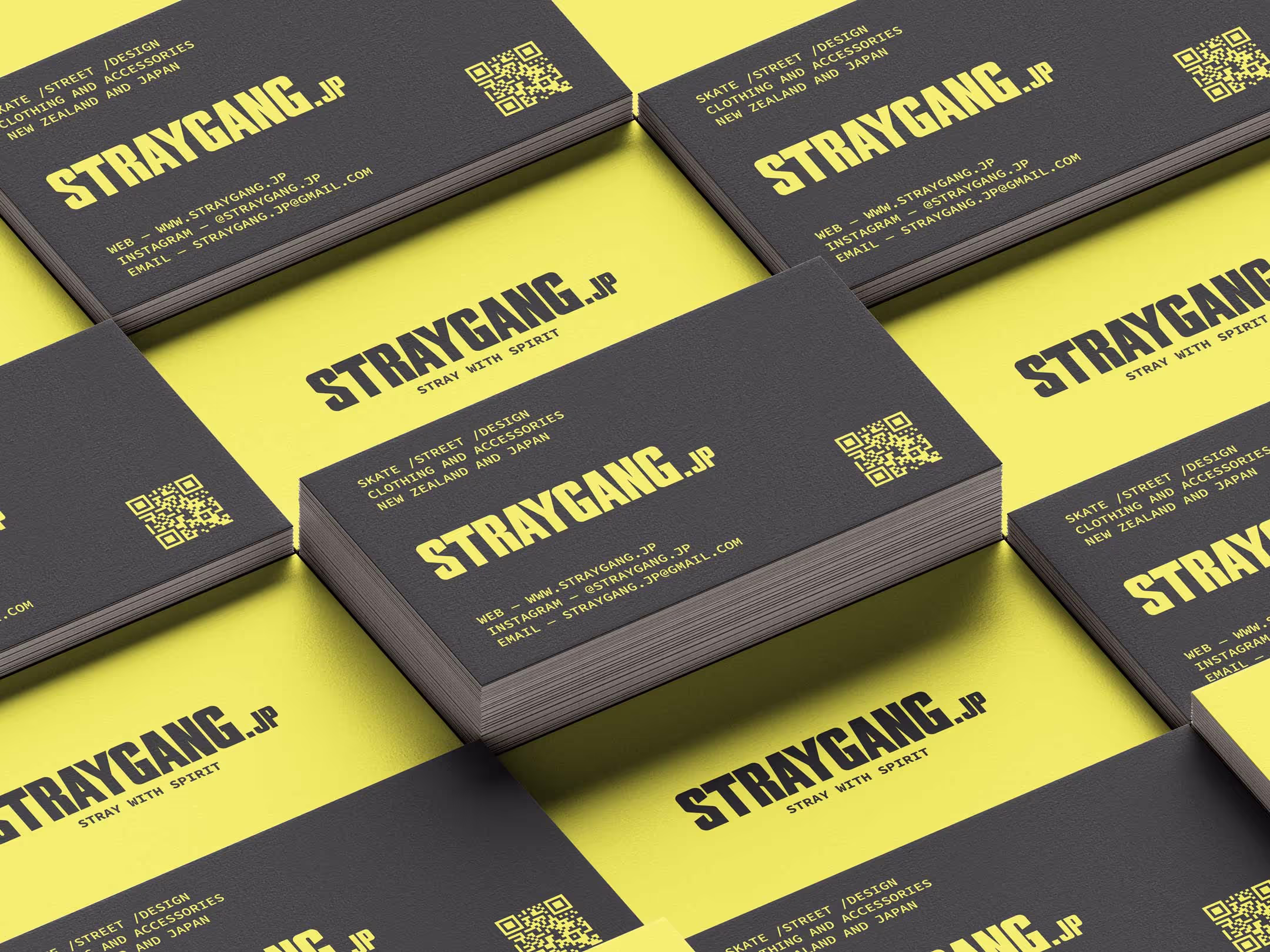 Straygang branded business cards laid out to show the design on both sides.
