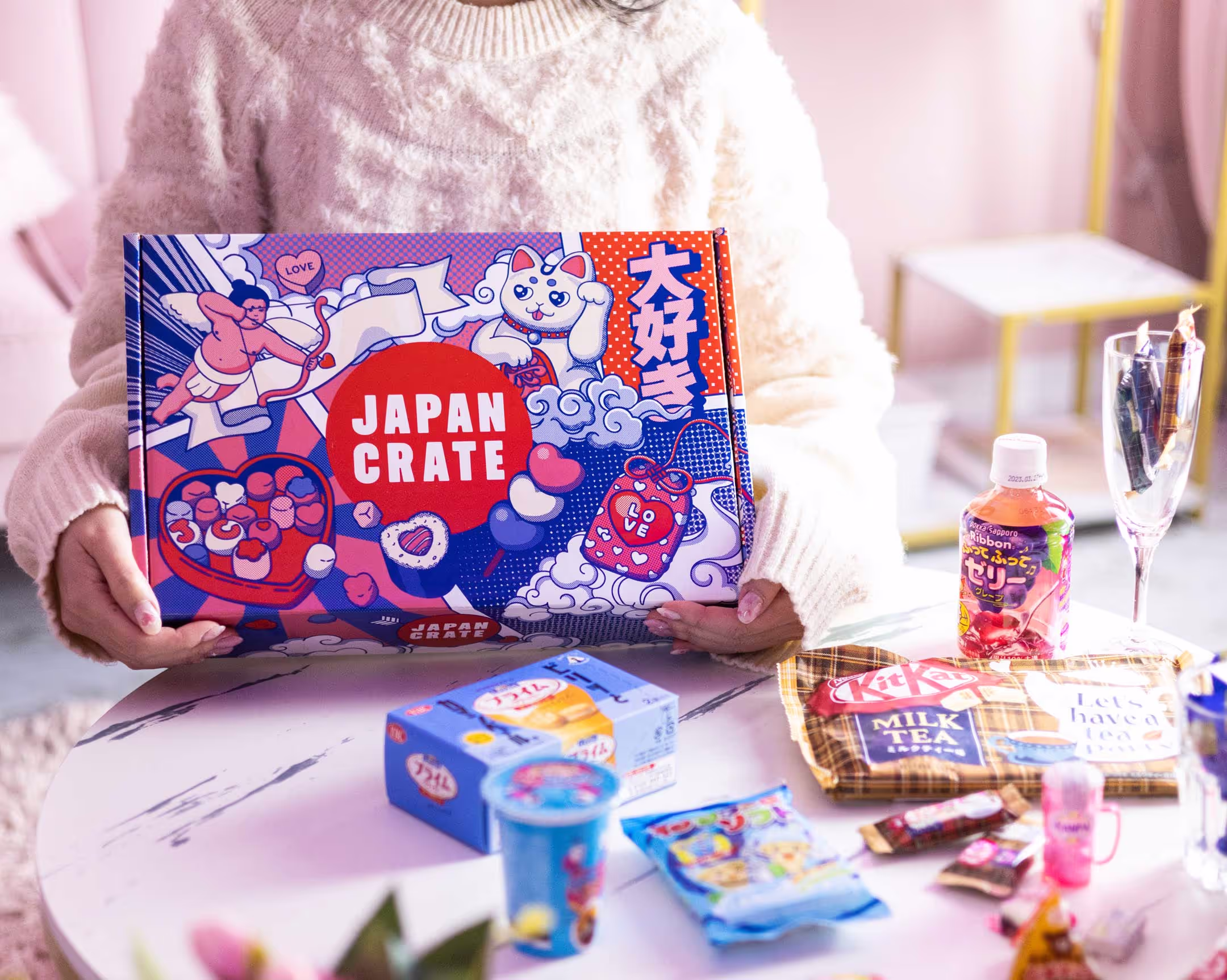 A package featuring art and branding inspired by valentine's day. The artwork is further emphasized by it's surroundings, a dream like tea room.